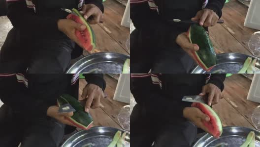 近距离拍摄的女人的手用菜刀切成熟的西瓜新鲜水果高清在线视频素材下载