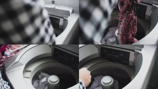 男人把衣服放进洗衣机- POV高清在线视频素材下载