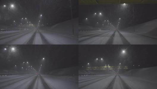 晚上在雪地里在高速公路上开车高清在线视频素材下载