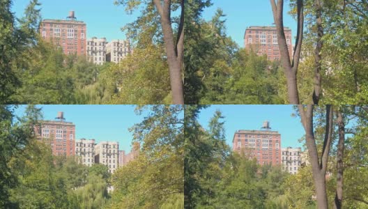 特写:在阳光明媚的纽约，俯瞰中央公园的豪华住宅楼高清在线视频素材下载