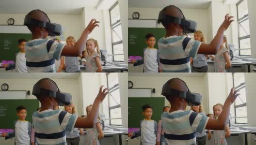 学生使用虚拟现实耳机在教室在学校4k高清在线视频素材下载