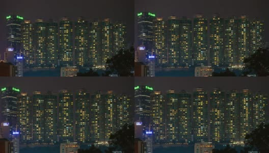 夜间照明香港城市公寓大楼正面全景4k时间推移高清在线视频素材下载