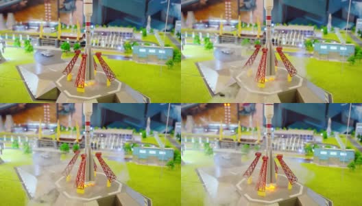 小型玩具火箭通过释放烟雾和点燃火焰来模拟从发射台起飞高清在线视频素材下载