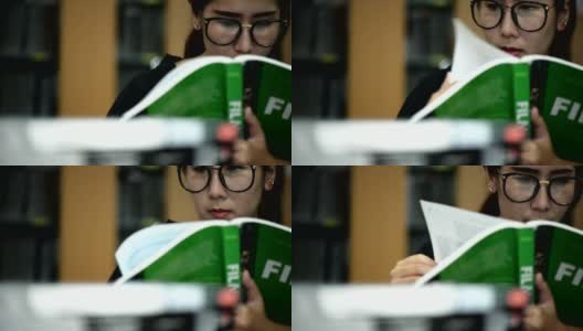 亚洲学生在图书馆看书高清在线视频素材下载