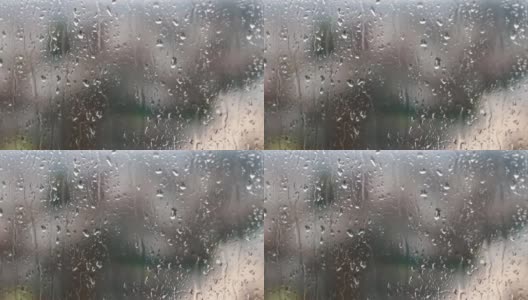 在春天的下午，雨滴落在玻璃上高清在线视频素材下载