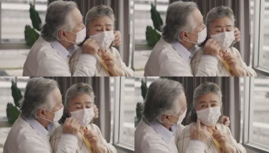 两对戴着口罩的亚洲老人互相拥抱，互相鼓励。高清在线视频素材下载