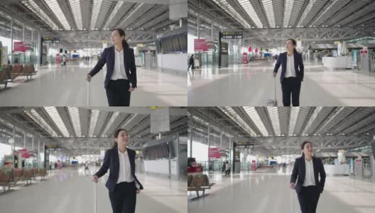 女商人在机场散步高清在线视频素材下载