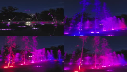 五彩缤纷的灯光音乐舞蹈城市喷泉。喷泉的碎片。明确coporful水。以公园为背景。晚上的时间。垂直新西伯利亚高清在线视频素材下载