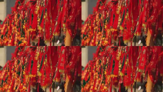 红旗在中国的鞭炮挂在树上，意味着财富，健康，最好的祝愿和好运高清在线视频素材下载