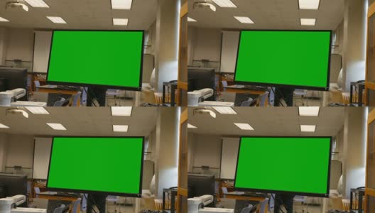 在一个空的大学生物实验室里的绿屏电脑显示器高清在线视频素材下载
