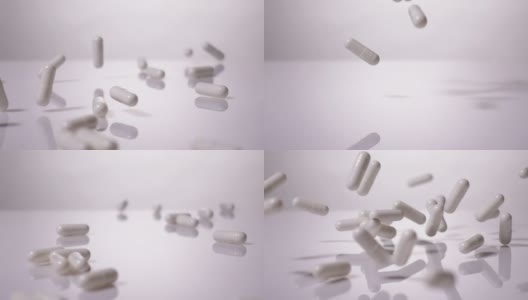 超级慢动作:白色胶囊滴在白色背景上高清在线视频素材下载