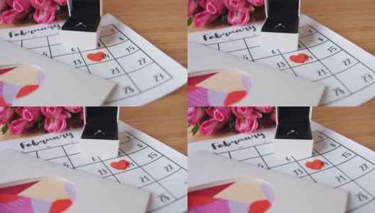 情人节的装饰玫瑰，戒指在礼盒，创意卡片和日历高清在线视频素材下载