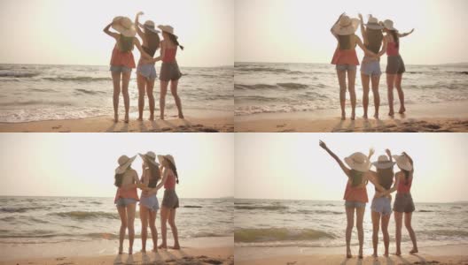 4K分辨率的后视图组混合种族的年轻女性在海滩上玩日落时间。生活方式朋友旅游度假夏季概念。慢动作镜头高清在线视频素材下载