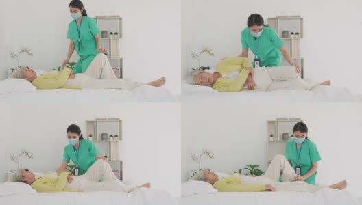 亚洲老年妇女在她的身体关节炎接受关节炎物理治疗康复专业护士或家庭健康助理在卧室在家。高清在线视频素材下载