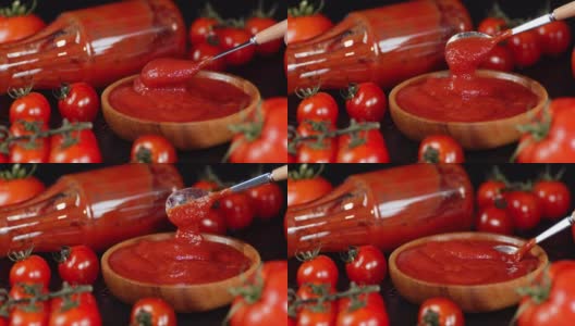 完成的番茄酱在碗里用勺子混合。高清在线视频素材下载