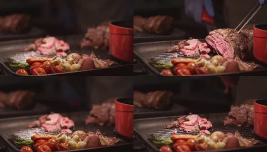 4K超高清手摇焦点:近距离厨师准备雕刻的上等肋牛肉在自助餐厅服务。高清在线视频素材下载