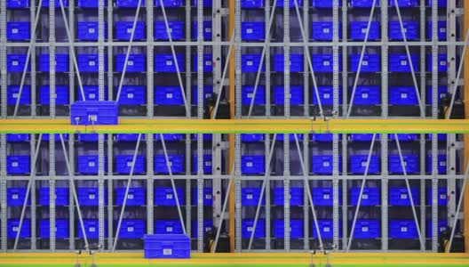 巨大的蓝色塑料集装箱堆放在配送仓库的板条箱里。高清在线视频素材下载