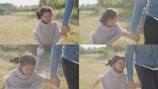 亚洲父母和可爱的孩子女孩一起在公园里跑步和玩耍高清在线视频素材下载