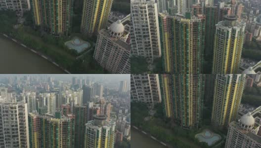 阳光灿烂的傍晚广州市滨江公寓住宅游泳池高空俯瞰4k中国全景高清在线视频素材下载