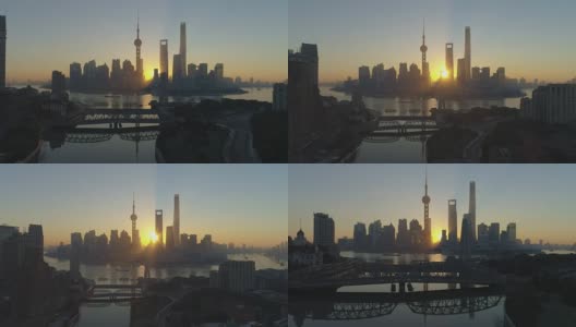 日出时的上海天际线和外白渡桥全景。陆家嘴金融区和黄浦江。中国鸟瞰图。无人机向后和向上飞行。远景。高清在线视频素材下载