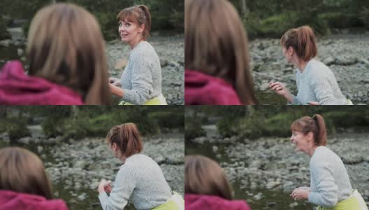 两个女人在湖上撇石头高清在线视频素材下载