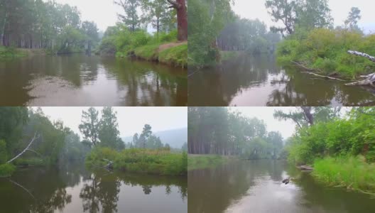 空中视频。夏季森林里有一条小山河高清在线视频素材下载