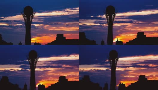 在哈萨克斯坦首都阿斯塔纳美丽的日落上，Bayterek塔的剪影高清在线视频素材下载