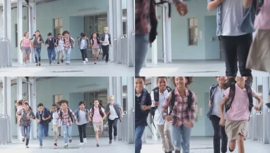 一群五年级的孩子在学校走廊上跑步高清在线视频素材下载