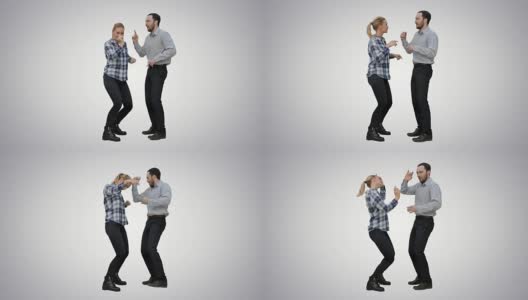 一对年轻的情侣在白色的背景上一起跳舞高清在线视频素材下载
