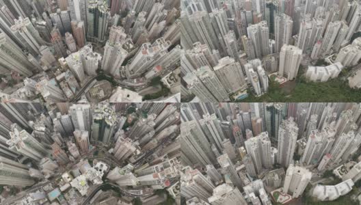 香港中环无人机鸟瞰图。现代化的摩天大楼和大都市的高楼大厦，城市交通系统。无人机是向前飞行和倾斜相机到90度。高清在线视频素材下载