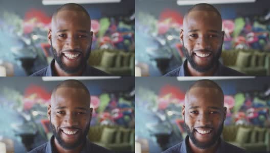 千禧一代黑人在工作场所的壁画前对着镜头微笑，大头照高清在线视频素材下载
