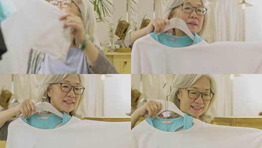 退休的中国妇女在购买春装高清在线视频素材下载