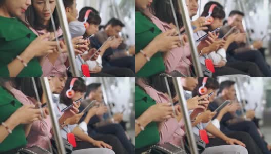 年轻人在公共地铁上使用手机高清在线视频素材下载