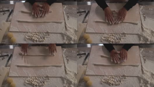 一名妇女在意大利面厂内揉面，准备做新鲜的土豆团高清在线视频素材下载