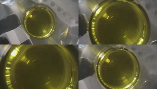 瓶中液体油性黄绿色溶液。和工具行业高清在线视频素材下载
