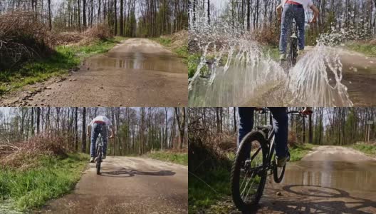 SLO MO下坡骑自行车通过一个水坑高清在线视频素材下载