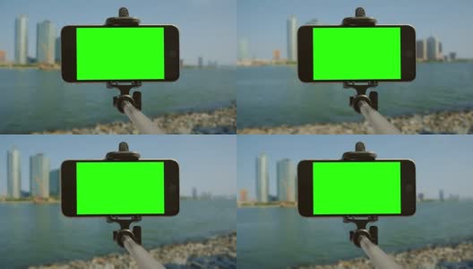 自拍杆城市绿屏智能手机chromakey移动高清在线视频素材下载