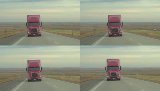 司机操纵大型集装箱半挂车在高速公路上行驶高清在线视频素材下载