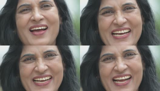 成熟快乐美丽的印度女人在户外街道上微笑的特写镜头高清在线视频素材下载