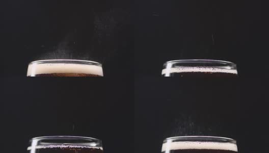 气泡可乐在一个玻璃喷射气体在一个黑色的背景。近距离高清在线视频素材下载