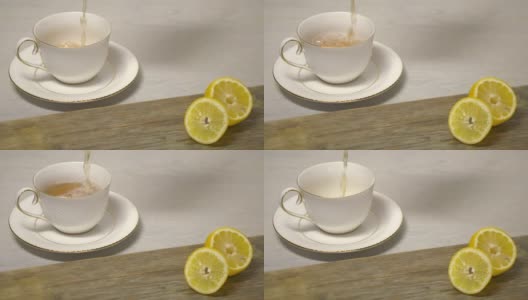 茶水倒入木桌上的白色茶杯中高清在线视频素材下载