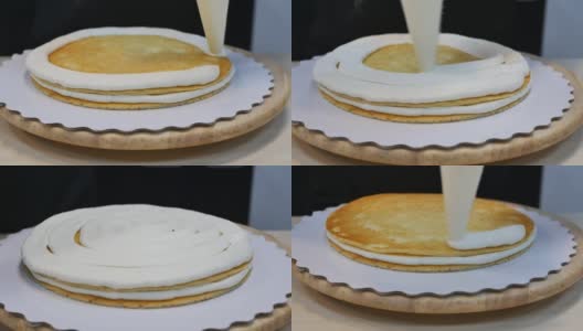 糕点师把袋子里的奶油挤到海绵蛋糕上高清在线视频素材下载