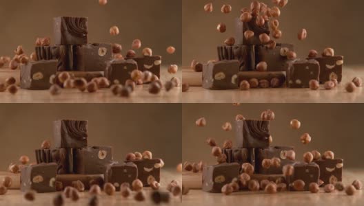 榛子巧克力软糖与成分下降在慢动作。使用幻影Flex 4K相机拍摄。高清在线视频素材下载