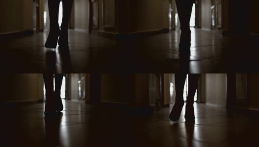 多莉与低截面腿剪影商界女性在高山鞋走走廊走廊在慢动作高清在线视频素材下载