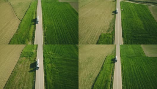 在美丽的乡村道路上的半拖车鸟瞰图高清在线视频素材下载