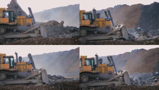 推土机移动石头和泥土高清在线视频素材下载
