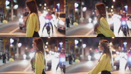 一个年轻女子在城市的深夜慢镜头中行走高清在线视频素材下载