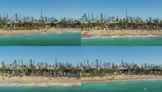 鸟瞰图的豪华海滩与迪拜摩天大楼的背景，阿联酋高清在线视频素材下载