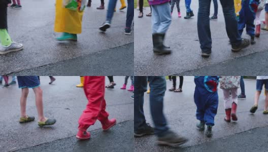 脚穿鞋走在柏油路上的孩子们在营地玩集体课活动。高清在线视频素材下载