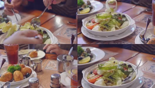 一家人在澳门葡萄牙餐厅吃饭，享受美味的烤什锦菜、炒蛤蜊、炒鳕鱼丸子，生活方式。高清在线视频素材下载